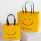 ISO-Schock-beständiges Lächeln-Gesichts-Kraftpapier-Papiertüte-gelbes Quadrat-untere Papiertüte