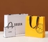 Schuh-kundenspezifische Papiereinkaufstaschen, die silberne Bevorzugungs-Taschen des Elfenbein-250gsm bronzieren